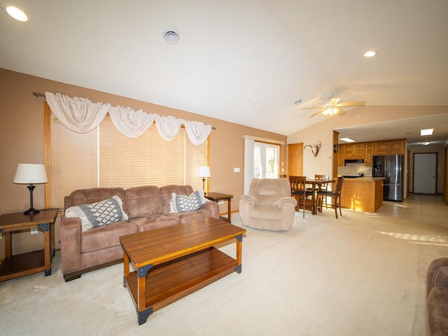 living room featuring recessed lighting, light carpet, ceiling fan, and vaulted ceiling