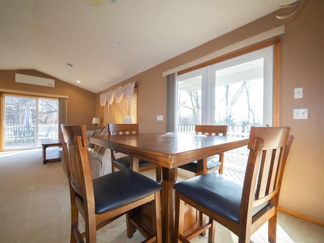 dining space featuring baseboards, light colored carpet, an AC wall unit, and lofted ceiling