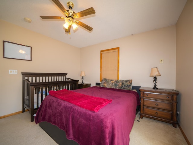 carpeted bedroom with baseboards and ceiling fan