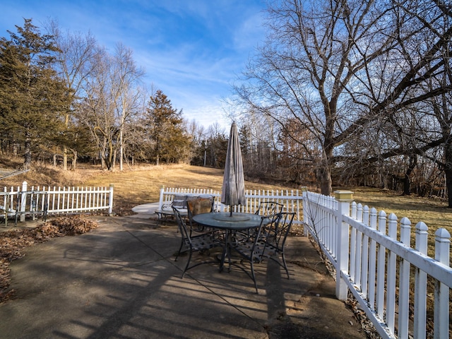 wooden deck with a patio area, outdoor dining space, and fence