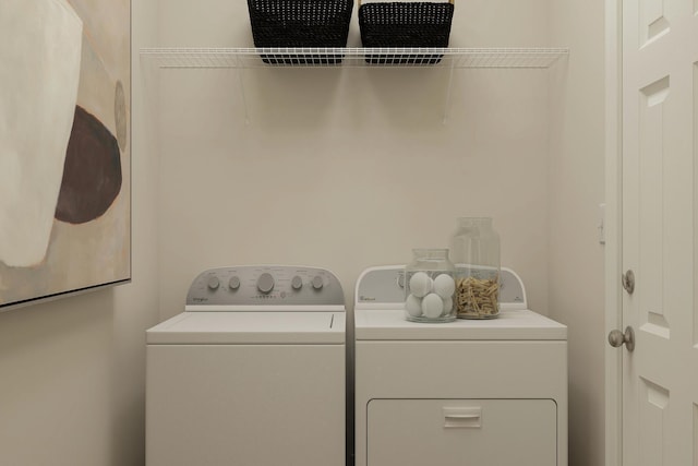 laundry area with washer and clothes dryer and laundry area