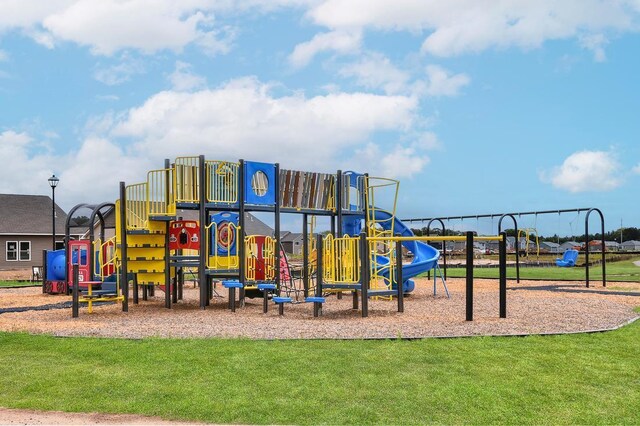 community play area featuring a lawn