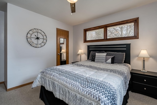 carpeted bedroom featuring ceiling fan and baseboards