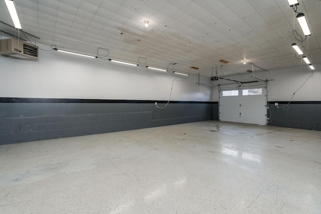 garage with concrete block wall