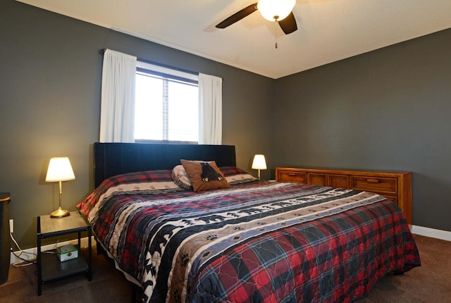 carpeted bedroom with a ceiling fan and baseboards