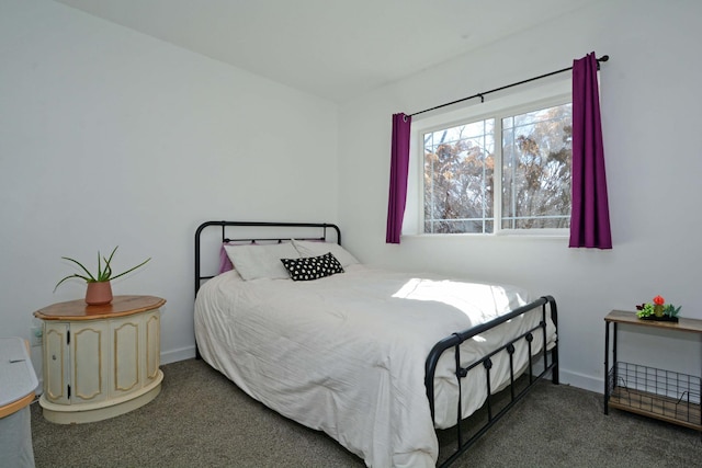 bedroom with carpet flooring and baseboards