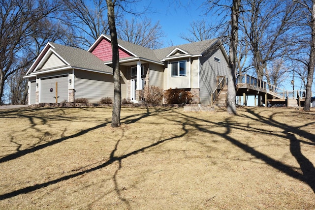 view of property exterior with stairs, an attached garage, and roof with shingles