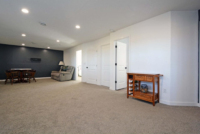 living area featuring carpet flooring, recessed lighting, and baseboards