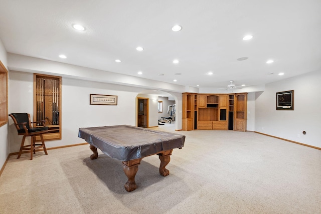 game room with recessed lighting, arched walkways, and light carpet