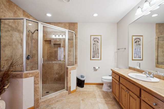 full bath with toilet, a stall shower, vanity, and baseboards