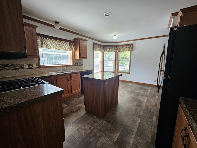 12148 Geneva Way, Apple Valley, MN 55124 - kitchen with decorative backsplash, dark wood-type flooring, plenty of natural light, and freestanding refrigerator