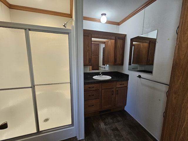 12148 Geneva Way, Apple Valley, MN 55124 - full bathroom featuring a stall shower, wood finished floors, vanity, and ornamental molding