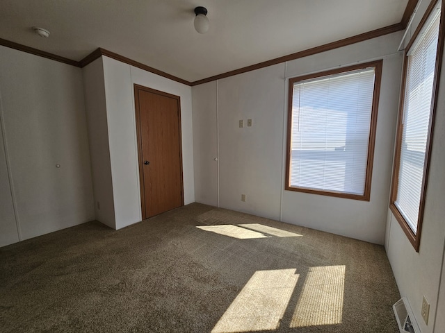 12148 Geneva Way, Apple Valley, MN 55124 - carpeted empty room with crown molding and visible vents