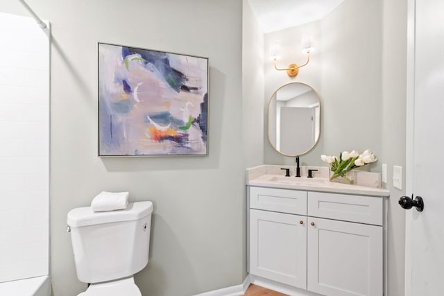 bathroom with shower / bath combination, baseboards, toilet, and vanity