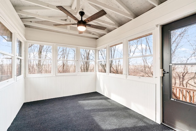 unfurnished sunroom featuring lofted ceiling with beams and a ceiling fan