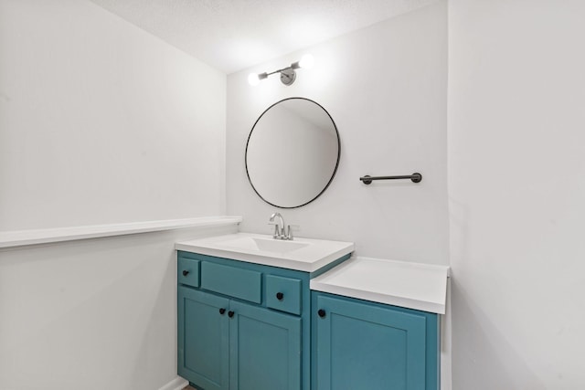 bathroom featuring vanity and baseboards