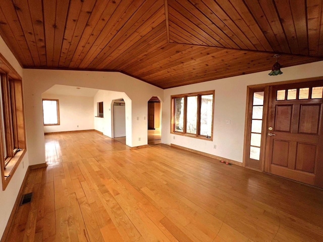 unfurnished living room featuring arched walkways, wood ceiling, vaulted ceiling, and hardwood / wood-style flooring