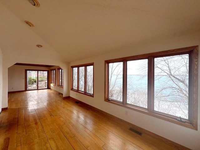 interior space featuring visible vents and lofted ceiling