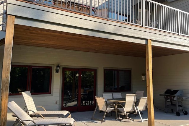 view of patio / terrace featuring grilling area, a balcony, and outdoor dining space