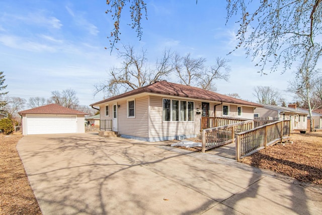 ranch-style home featuring an outdoor structure, driveway, and a detached garage