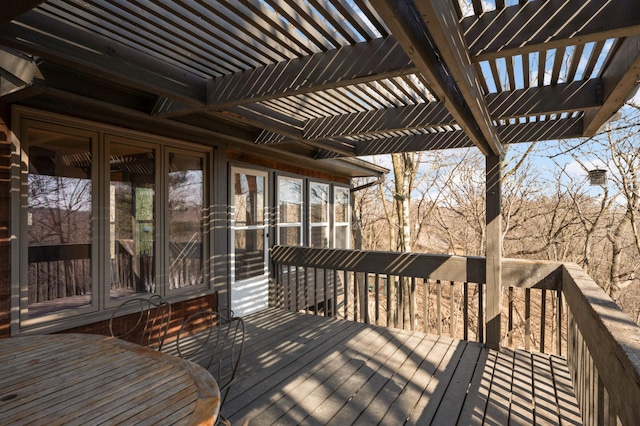 wooden deck featuring a pergola