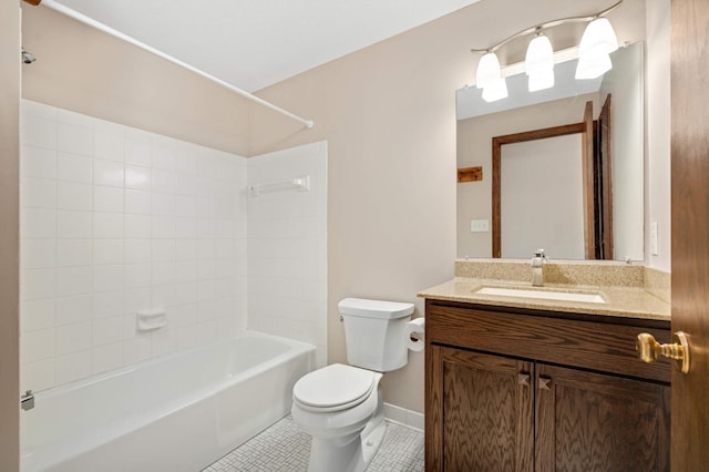 bathroom with tile patterned floors, toilet, baseboards, bathing tub / shower combination, and vanity