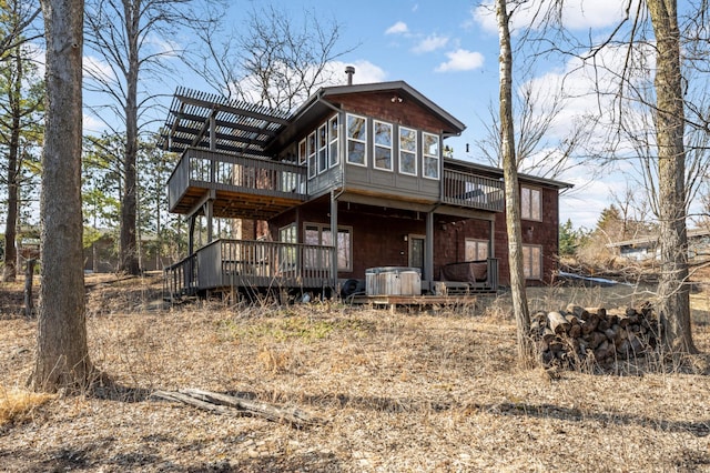 back of house featuring a deck