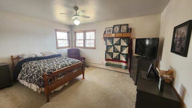 carpeted bedroom featuring a baseboard radiator and ceiling fan