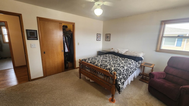 bedroom with a closet, carpet floors, and baseboards