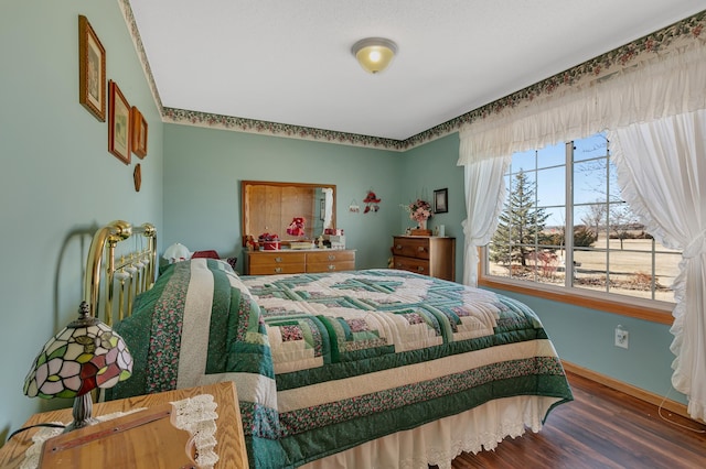 bedroom featuring wood finished floors