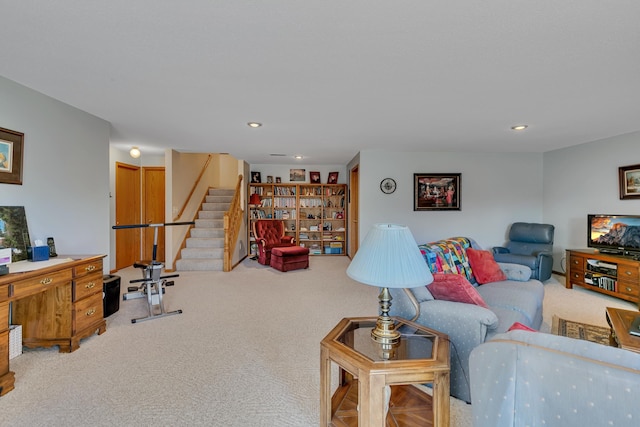 living area with stairs, recessed lighting, and carpet floors