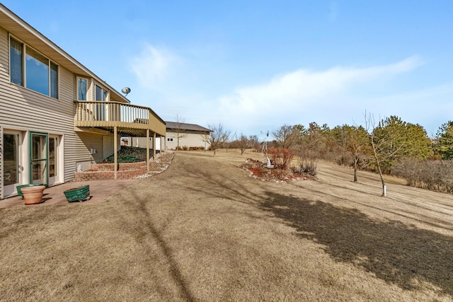 view of yard featuring a wooden deck