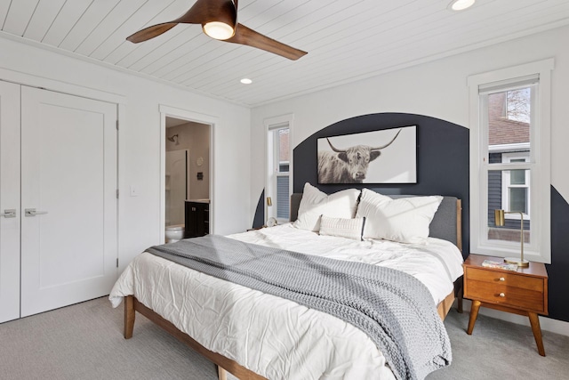 bedroom featuring ensuite bath, wood ceiling, recessed lighting, and light colored carpet