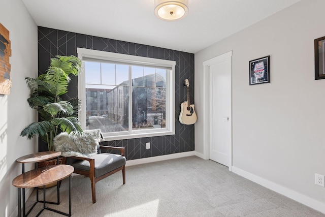 living area with carpet flooring and baseboards