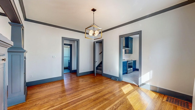 unfurnished room featuring visible vents, baseboards, a chandelier, stairs, and light wood-style floors