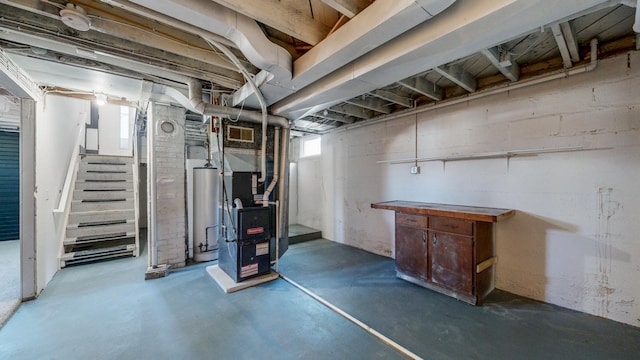 basement with heating unit, gas water heater, stairs, and a healthy amount of sunlight