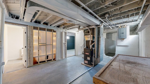 unfinished basement with electric panel and heating unit