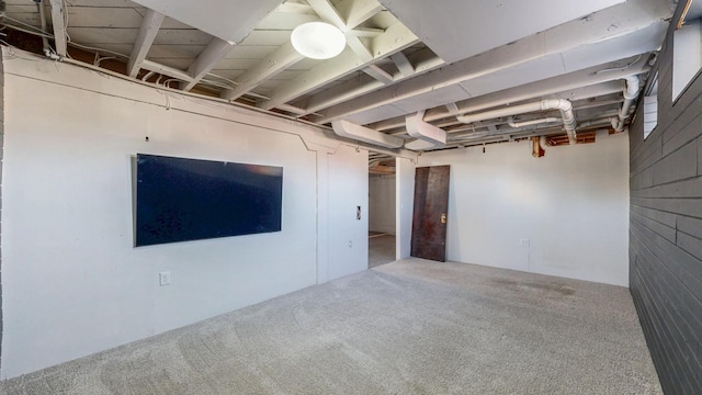 unfinished basement featuring carpet flooring