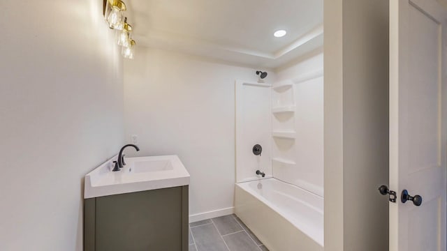 bathroom featuring vanity, recessed lighting, baseboards, and shower / washtub combination