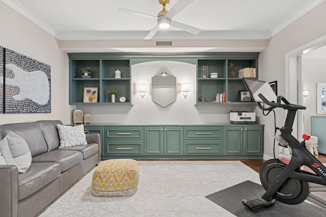 living area featuring visible vents, baseboards, ornamental molding, a ceiling fan, and dark wood-style flooring