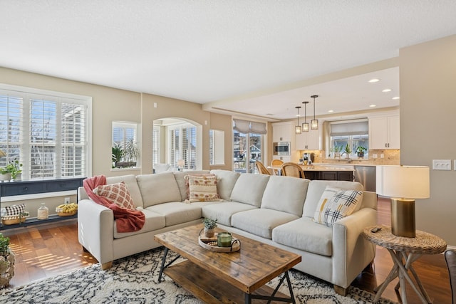 living room featuring recessed lighting and light wood finished floors