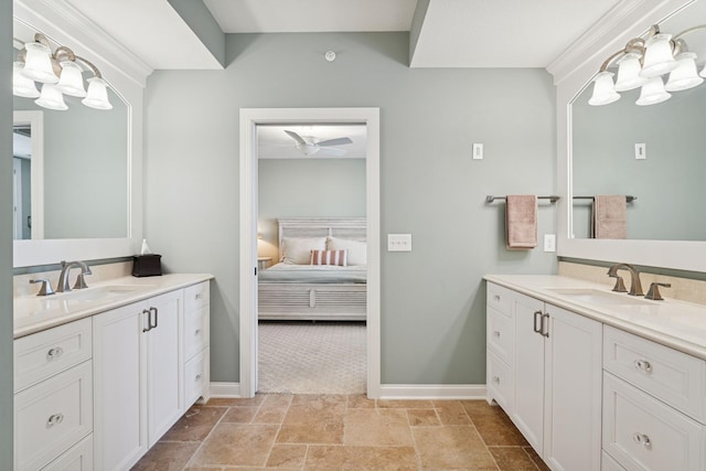 full bathroom with a sink, two vanities, and ensuite bath