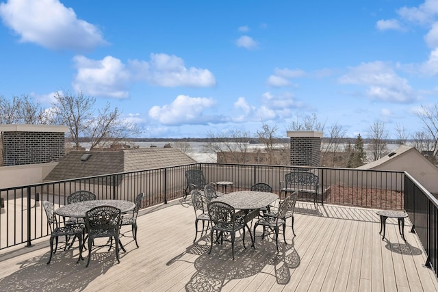 deck with outdoor dining area