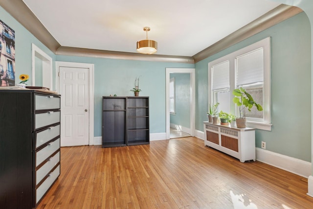 interior space with light wood-style floors and baseboards