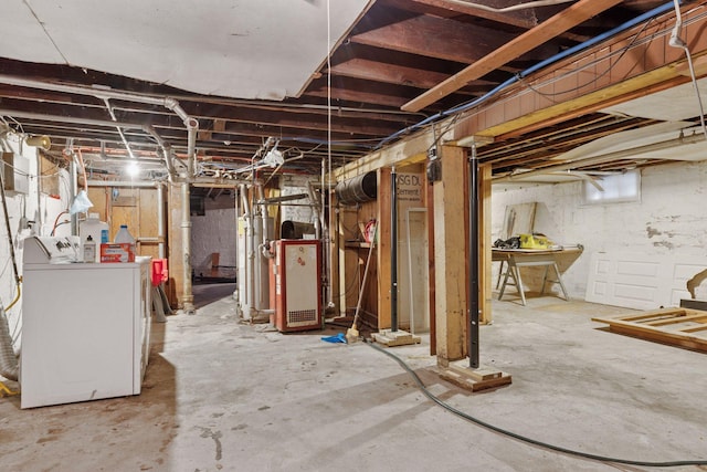 unfinished basement with water heater and washing machine and clothes dryer