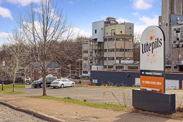 view of property featuring uncovered parking