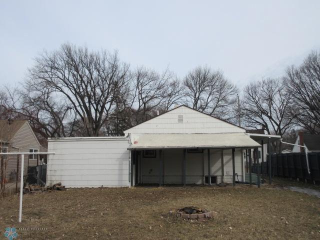 view of outdoor structure with fence