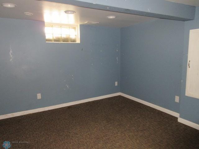 below grade area with carpet flooring and baseboards