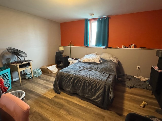 bedroom with wood finished floors