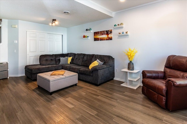 living area with visible vents, baseboards, a textured ceiling, and dark wood-style flooring